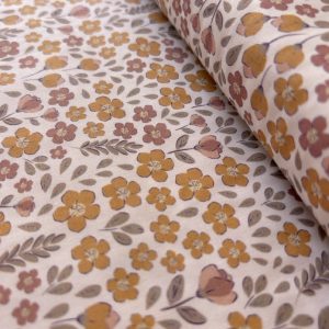 Algodón estampado · flores mostaza y teja