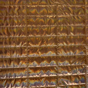 Tejido acolchado metalizado color cobre